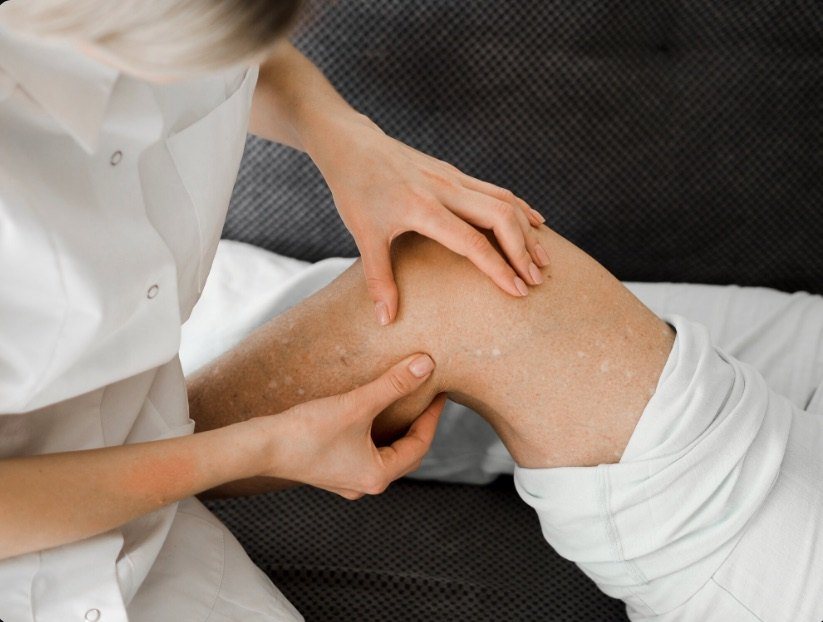 Hands-on soft tissue work on a patient's arm